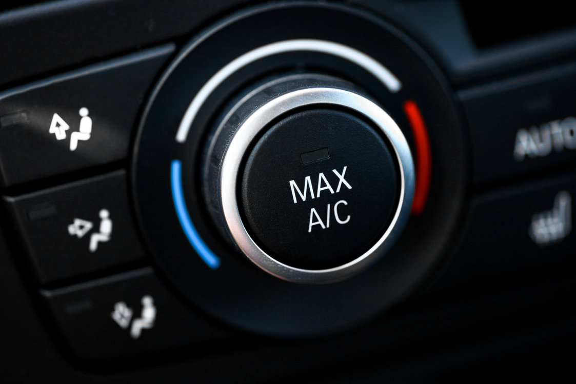 Car air conditioning MAX A/C button for summer heat protection in Georgia